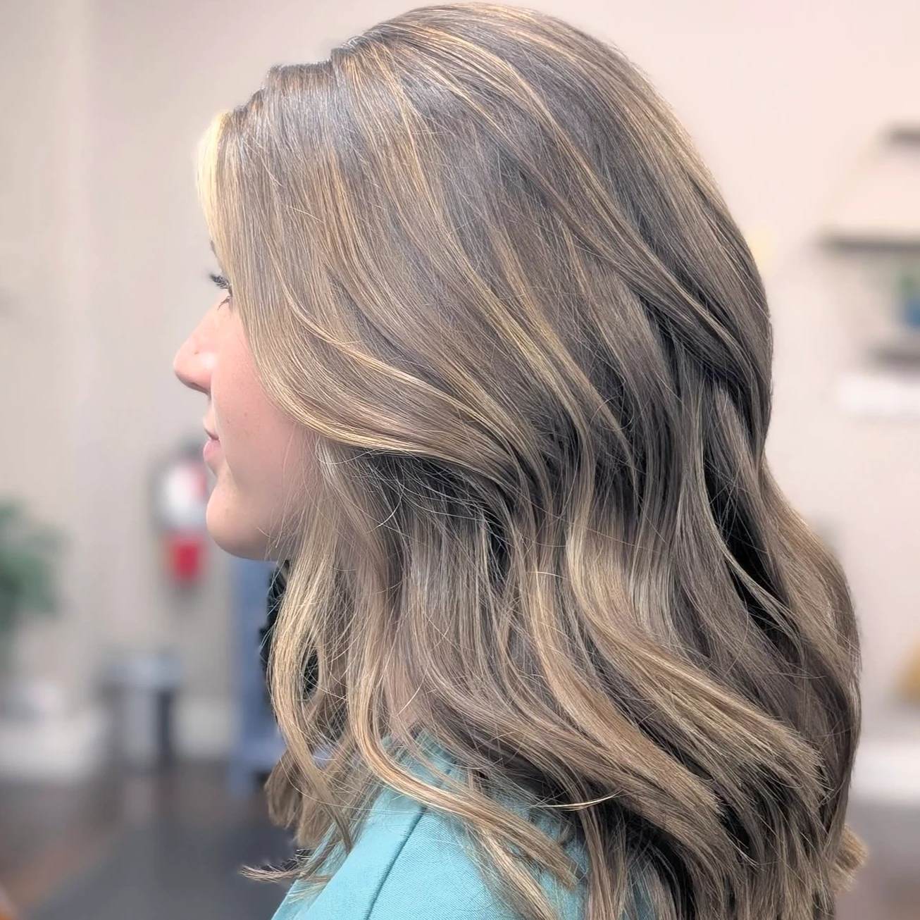 Dimensional blonde highlights with a soft blowout by Davis White Salon